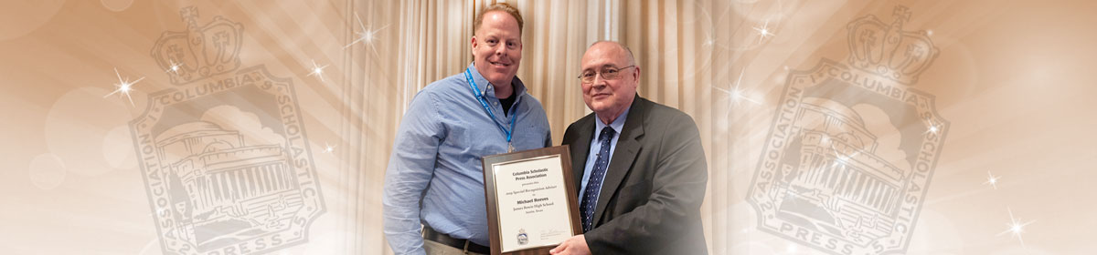 Reeves holding award