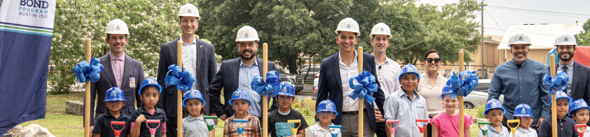 Image with Bond team and children at Groundbreaking Event