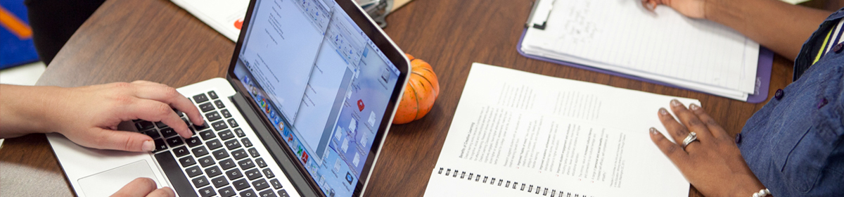 photo of students on a computer