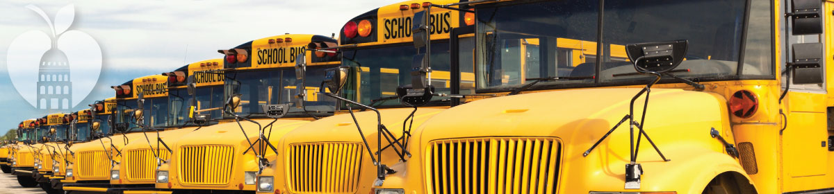 photo of a line of Austin ISD yellow school buses parked side by side