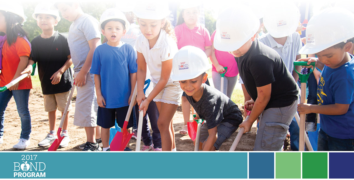 Students with shovel at groundbreaking ceremony