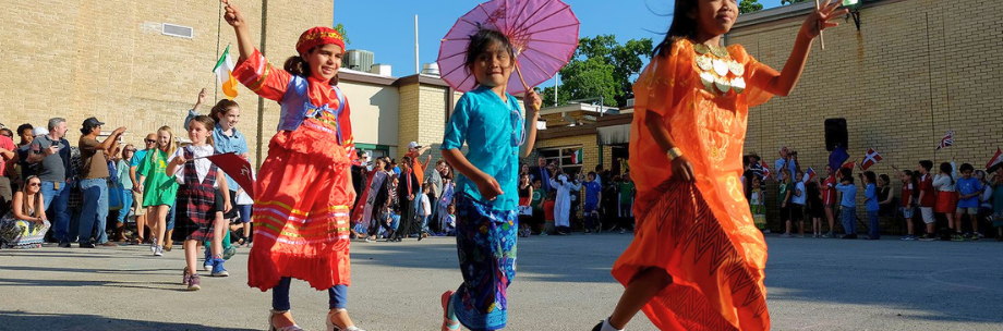 Elementary students walking in courtyard school