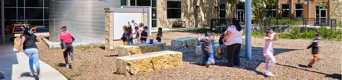 Govalle elementary students playing at the outdoor classroom