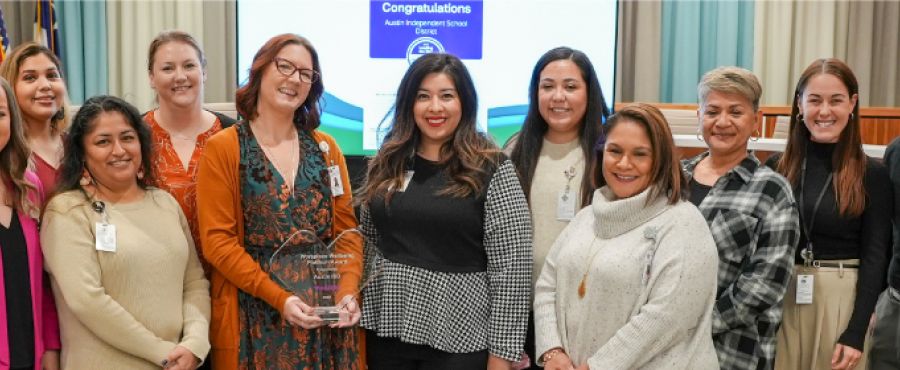 Austin isd talent strategy and benefits teams accepting their aetna platinum award