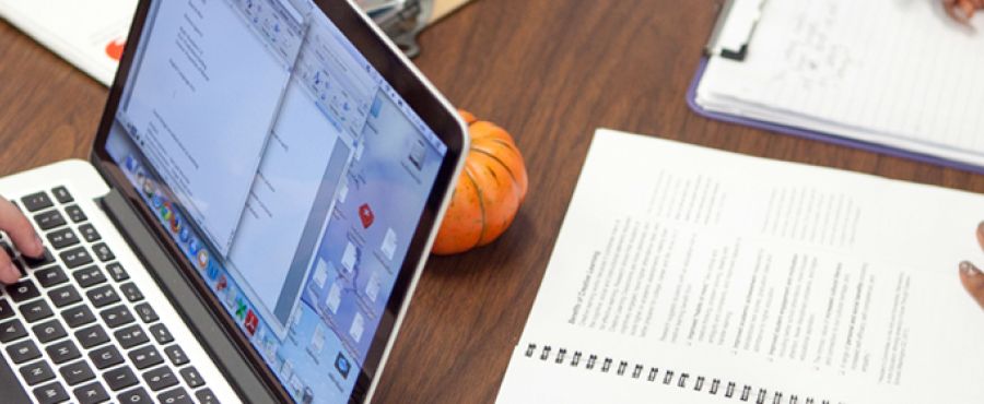photo of students on a computer