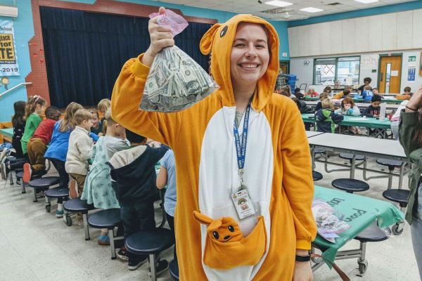teacher holding money