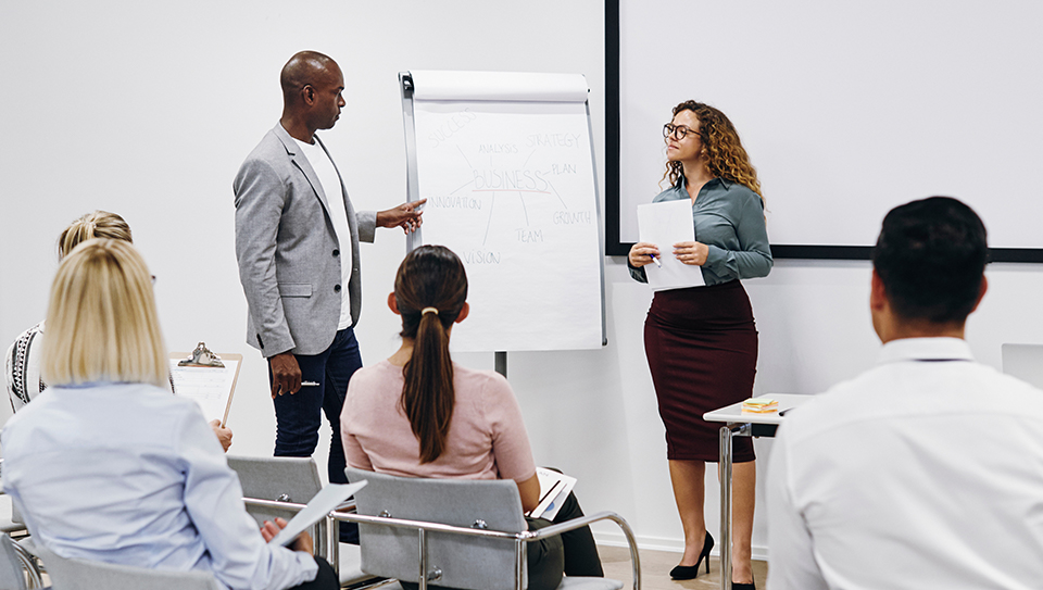 Adult discussing materials and leader listening